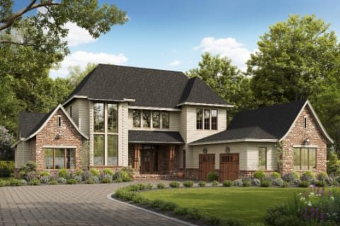 Two-story suburban house with brick and siding exterior, large windows, three gables, and a double garage, surrounded by trees and landscaped yard.